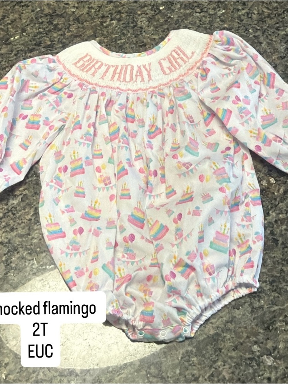 Smocked Flamingo ‘Birthday Girl' White One-Piece with Rainbow Cake Print